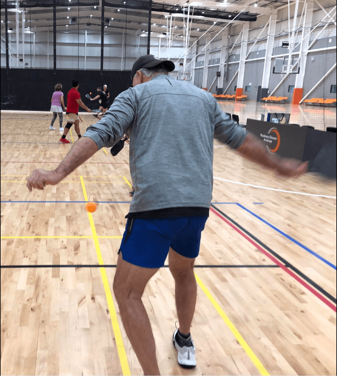 Player demonstrating pickleball swing technique